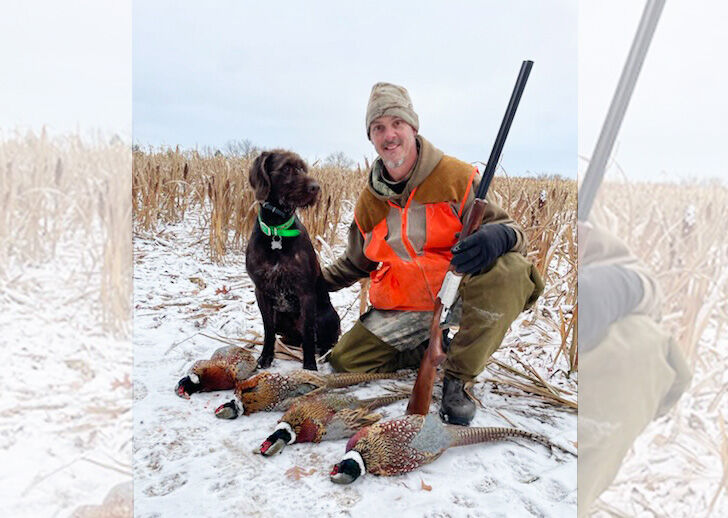 man with his dog hunting pheasant